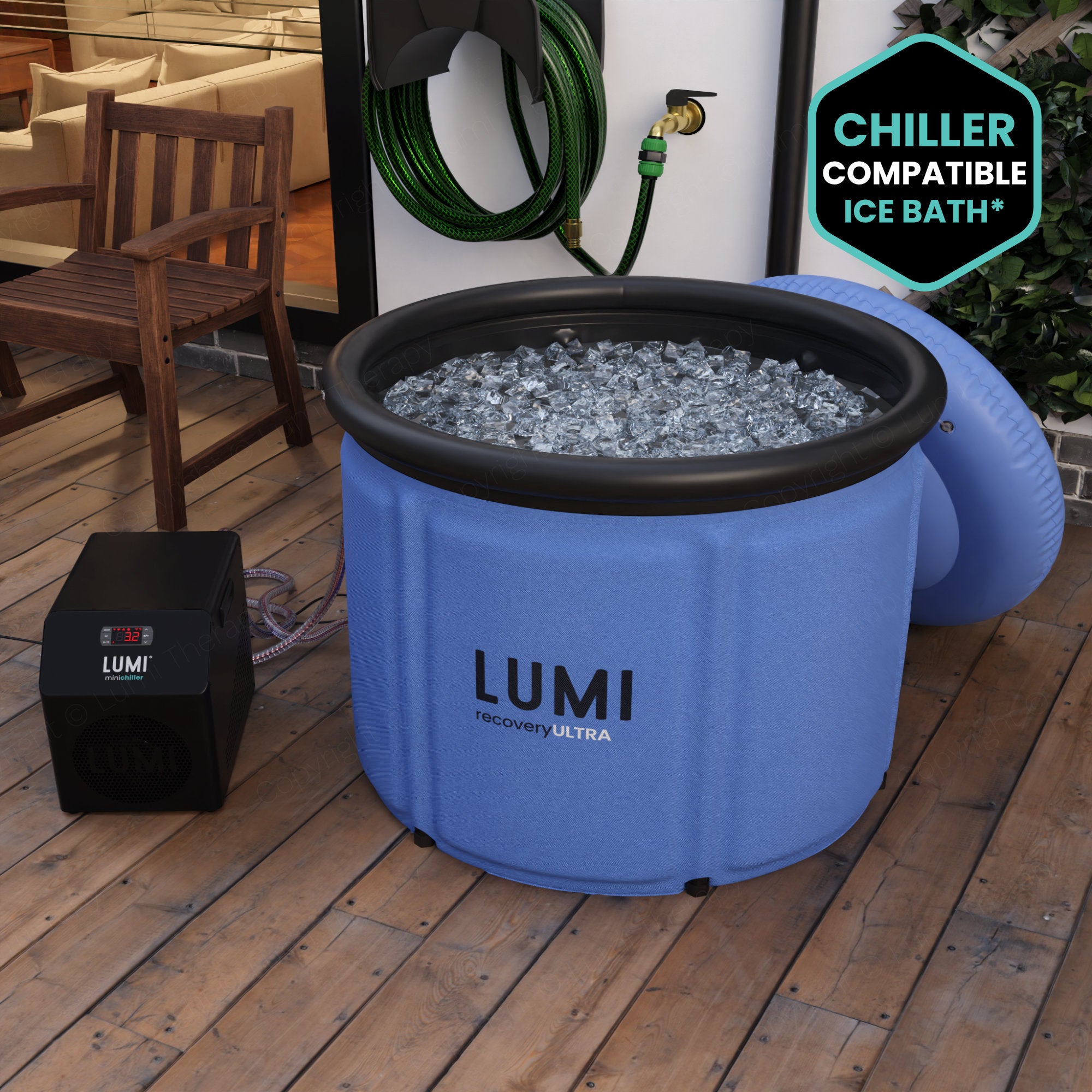 The Ocean blue LUMI Max Ultra ice bath, filled with ice in a garden setting.
