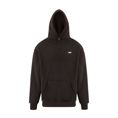 Unisex LCC Oversized Hoodie Black featuring a minimalist design with front kangaroo pocket, adjustable hood, ribbed cuffs, and small white LUMI logo on chest. Back displays LUMI Cold Club graphic. Premium black cotton-polyester blend fabric showcases modern streetwear aesthetic.