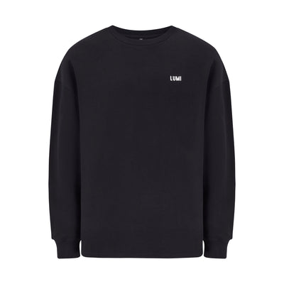 Unisex LCC Oversized Sweatshirt Black featuring a minimalist design with small white LUMI logo on chest. Classic black heavyweight cotton-polyester blend sweatshirt with ribbed cuffs and hem, shown flat against white background. Perfect for post-ice bath comfort and everyday wear.