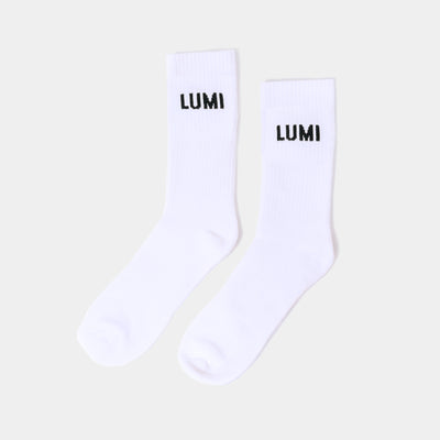 Pro Bamboo Socks (4 Pack) - White athletic socks with black LUMI logo displayed on cuff, featuring elasticated support and bamboo fiber construction for comfort and breathability. Photographed as a pair against light background.